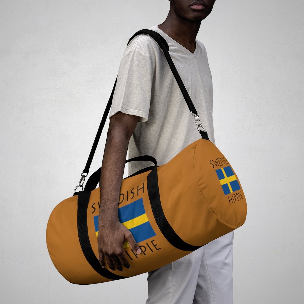 You will love Stately Wear's Swedish Flag Hippie™ duffel bag. Katie Couric Shop partner. Perfect accessory as a beach bag, ski bag, travel bag & gym or yoga bag.  Custom made one-at-a-time.  Environmentally friendly.  Biodegradable inks & dyes.  Good for the planet. 2 sizes to choose.