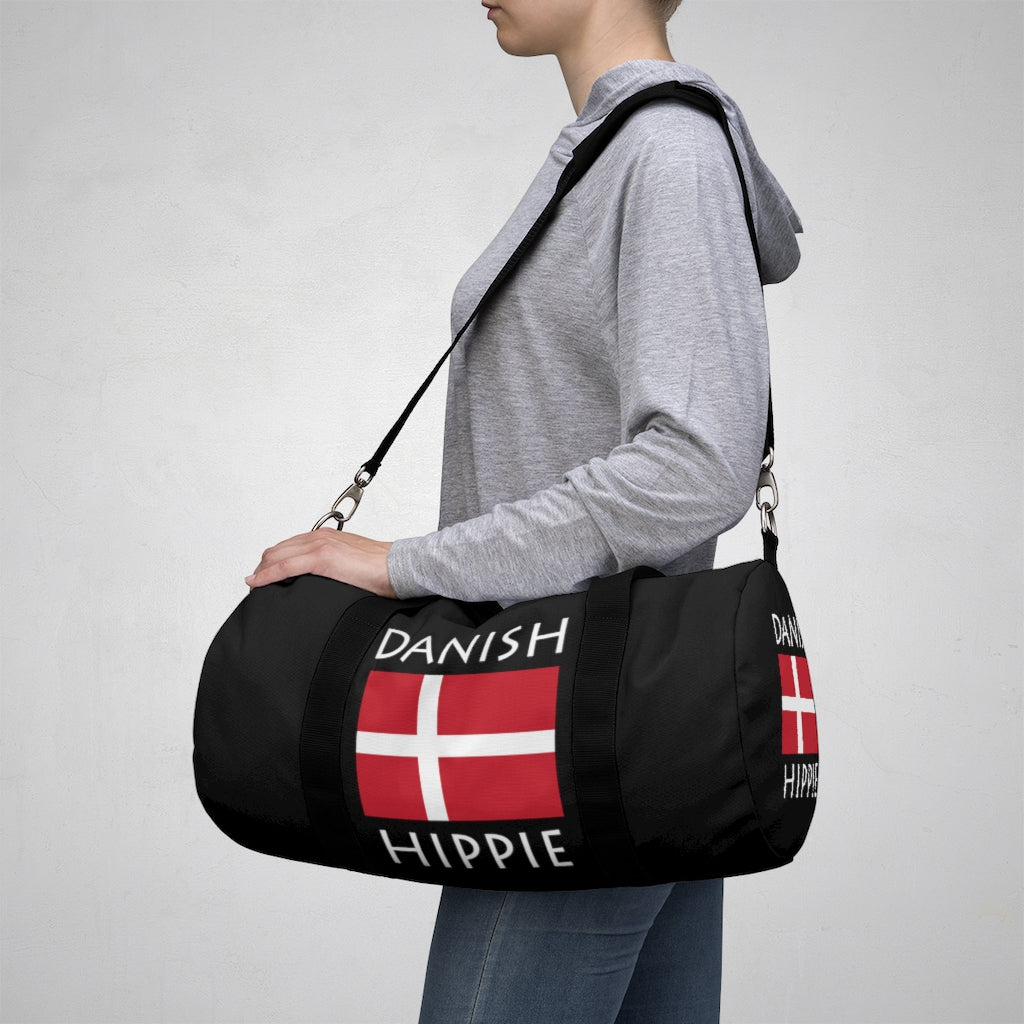 Stately Wear's Danish Flag Hippie duffel bag. We are a Katie Couric Shop partner. The perfect accessory as a beach bag, ski bag, travel bag & gym or yoga bag. Custom made one-at-a-time. Environmentally friendly. Biodegradable inks & dyes. Good for the planet. 2 sizes to choose.