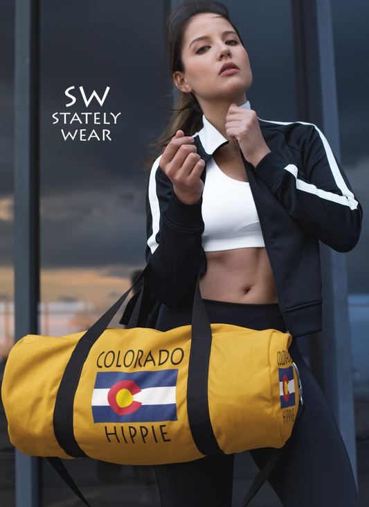Stately Wear's Colorado Flag Hippie duffel bag. We are a Katie Couric Shop partner. The perfect accessory as a beach bag, ski bag, travel bag & gym or yoga bag. Custom made one-at-a-time. Environmentally friendly. Biodegradable inks & dyes. Good for the planet. 2 sizes to choose.