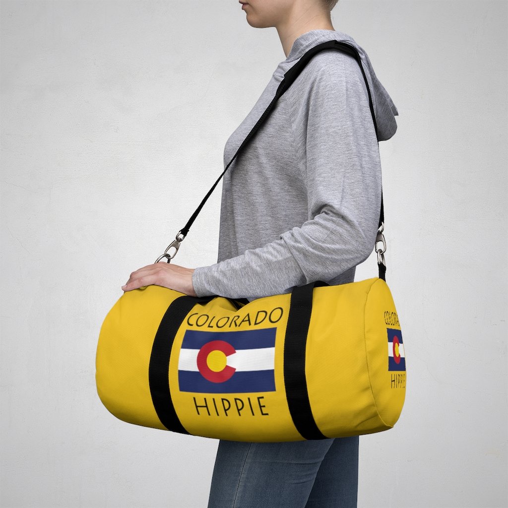 Stately Wear's Colorado Flag Hippie duffel bag is colorful, iconic and Boho stylish. We are a Katie Couric Shop partner. This duffel bag is the perfect accessory as a beach bag, ski bag, travel bag, shopping bag & gym bag, Pilates bag or yoga bag. Custom made one-at-a-time with environmentally friendly biodegradable inks & dyes. 2 sizes to choose. Stately Wear's bags are very durable, soft and colorful duffels with durable straps.