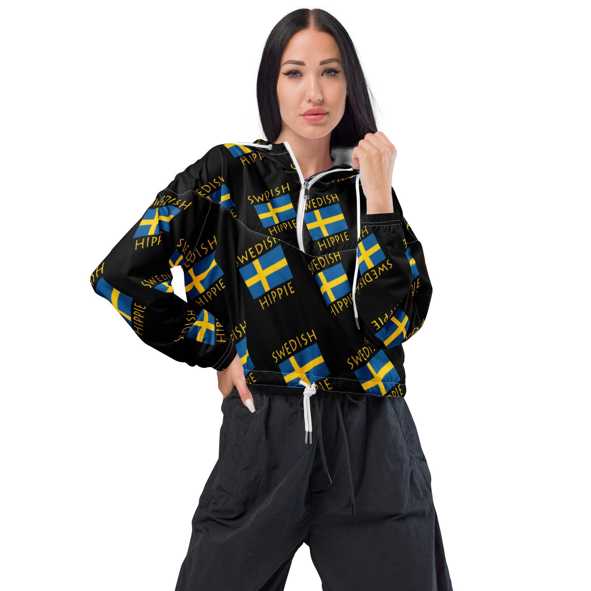 This Swedish Flag Hippie™ stylish cropped half-zip windbreaker is a fashion statement! The repeating Swedish Flag Hippie design is the coolest, hippest, trendiest piece in your wardrobe! Hike in style without the rain getting in the way...this cropped windbreaker is lightweight, waterproof, and suitable for every kind of adventure. Features include side-slit pockets, breathable mesh lining, and adjustable drawstring on the hood and waist to support all your stylish outdoor looks.